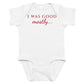 White baby bodysuit with I Was Good Mostly printed in red on the front