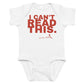White baby bodysuit with I Can't Read This printed in red on the front