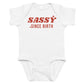White baby bodysuit with Sassy Since Birth printed in red on the front