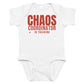 White baby bodysuit with Chaos Coordinator In Training printed in red on the front