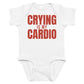 White baby bodysuit with Crying Is My Cardio printed in red on the front