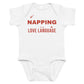 White baby bodysuit with Napping Is My Love Language printed in red on the front