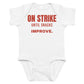 White baby bodysuit with On Strike Until Snacks Improve printed in red on the front