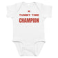 White baby bodysuit with Tummy Time Champion printed in red on the front