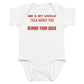 White baby bodysuit with Me & My Uncle Talk About You Behind Your Back printed in red on the front