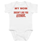 White baby bodysuit with My Mom Doesn't Like You Either printed in red on the front