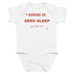 White baby bodysuit with Running On Zero Sleep Just Like Mom printed in red on the front