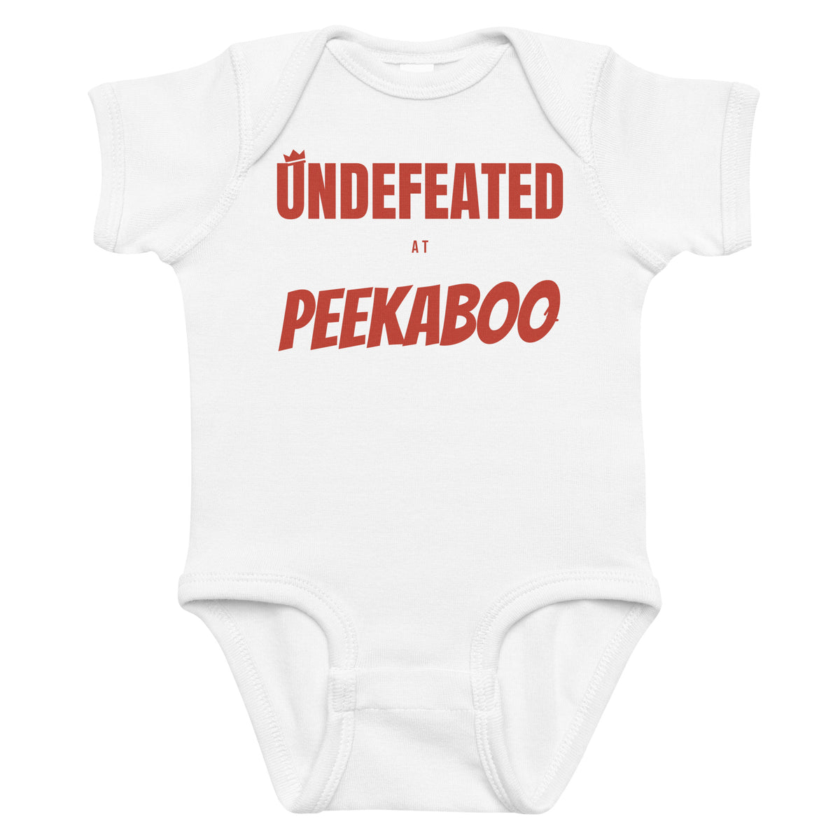 White baby bodysuit with Undefeated At Peekaboo printed in red on the front