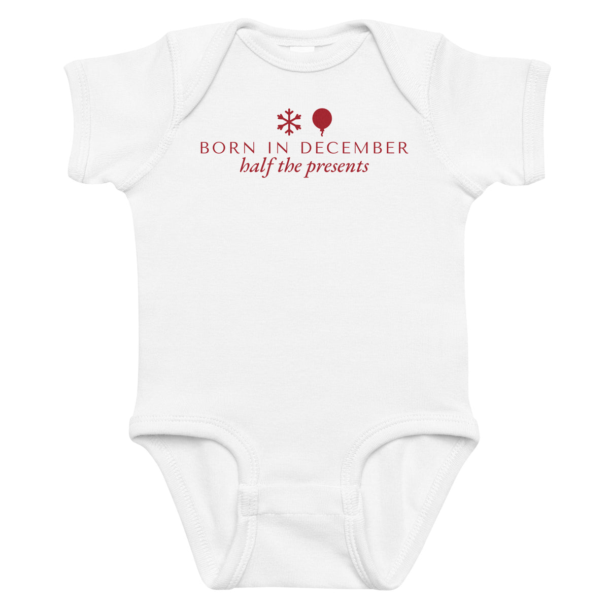 White baby bodysuit with Born In December printed in red on the front
