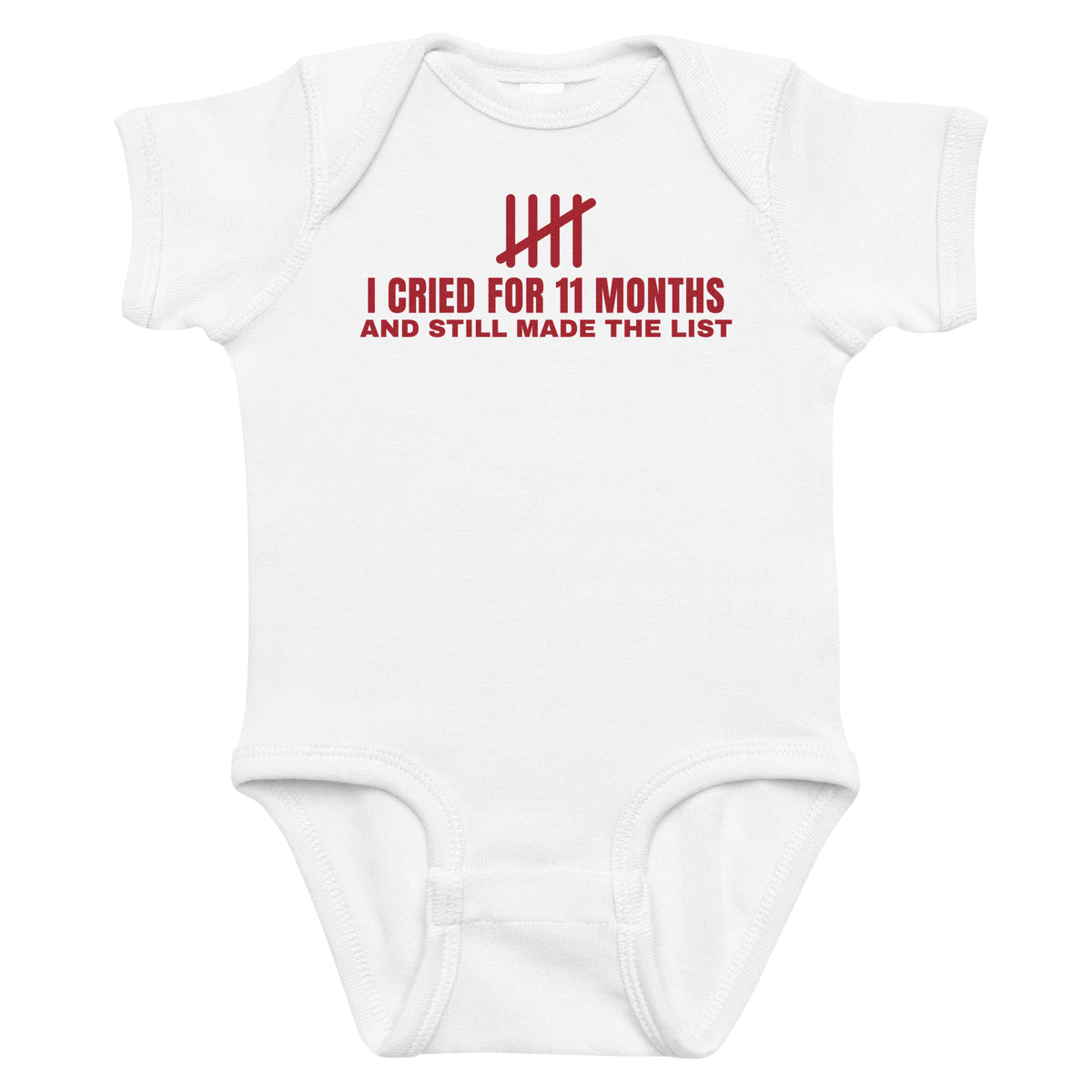 White baby bodysuit with I Cried For 11 Months And Still Made The List printed in red on the front