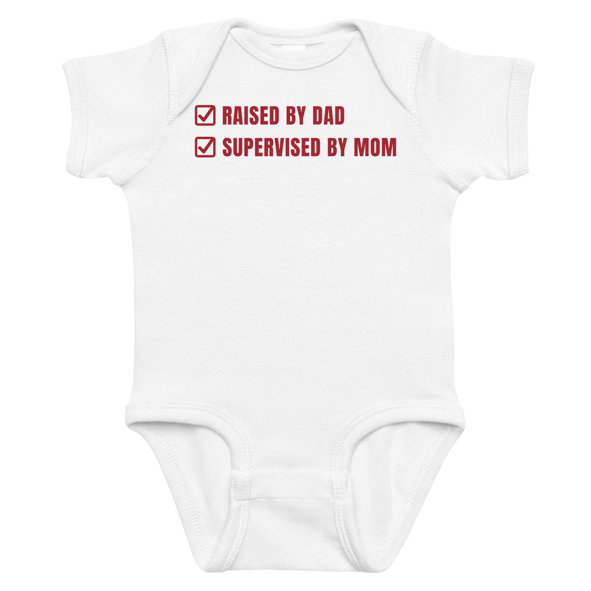 White baby bodysuit with Raised By Dad Supervised By Mom printed in red on the front