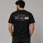 Man from behind wearing a black t shirt with Be Careful I'm Not Sure Which Me I Am Today printed on the back