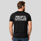 Man from behind wearing a black t shirt with Being Sexy Is A Nasty Job But Someone Has To Do It printed on the back