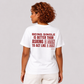 Woman from behind wearing a white t shirt with Being Single Is Better Than Asking A Man To Act Like A Man printed on the back