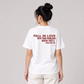 Woman from behind wearing a white t shirt with Fall In Love With Your Problems Maybe They'll Leave You Too printed on the back