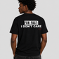Man from behind wearing a black t shirt with Fun Fact I Don't Care printed on the back