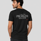 Man from behind wearing a black t shirt with I Am The Problem Solver printed on the back