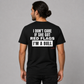 Man wearing a black graphic tee with I Don't Care If She Got Red Flags I'm A Bull printed on the back, rear view