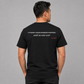 Man from behind wearing a black t shirt with I Think I Have Enough Puppies Said No One Ever printed on the back