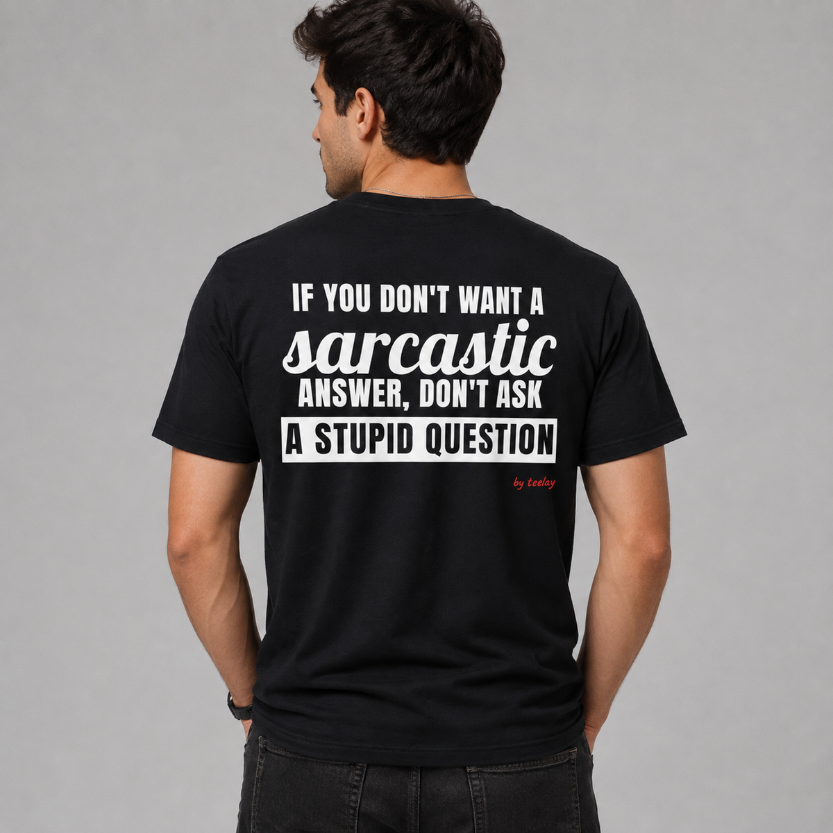 Man from behind wearing a black t shirt with If You Don't Want A Sarcastic Answer Don't Ask A Stupid Question printed on the back