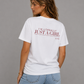 Woman from behind wearing a white t shirt with I'm Literally Just A Girl printed on the back