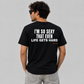 Man from behind wearing a black t shirt with I'm So Sexy That Even Life Gets Hard printed on the back