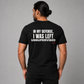 Man from behind wearing a black t shirt with In My Defense I Was Left Unsupervised printed on the back