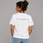 Woman from behind wearing a white t shirt with In My Successful Girl Era printed on the back