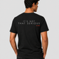 Man from behind wearing a black t shirt with It's Not That Serious printed on the back