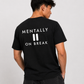 Man from behind wearing a black t shirt with Mentally On Break printed on the back