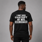 Man from behind wearing a black t shirt with My Wife Knows Everything printed on the back
