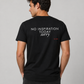 Man from behind wearing a black t shirt with No Inspiration Today Sorry printed on the back