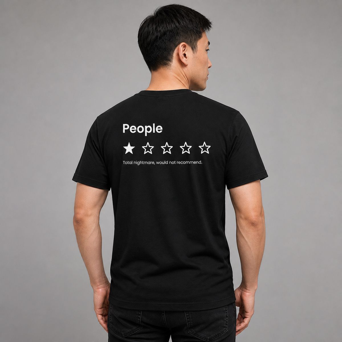 Man from behind wearing a black t shirt with a one star People review printed on the back