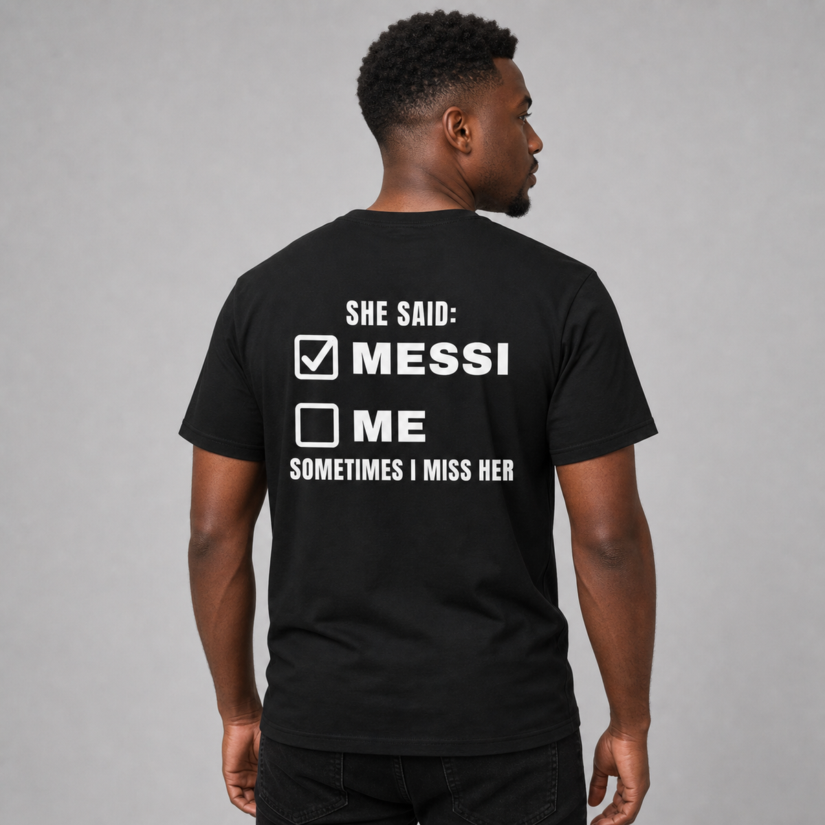 Man from behind wearing a black t shirt with She Said Not Me Sometimes I Miss Her checklist printed on the back