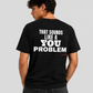 Man from behind wearing a black t shirt with That Sounds Like A You Problem printed on the back
