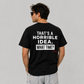 Man in sunglasses wearing a black graphic tee with That's A Horrible Idea What Time on the back